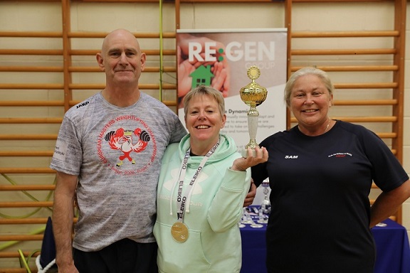 Alison Crompton of Triple X receiving trophy for Best Masters Lifter